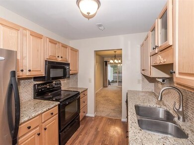 Remodelled kitchen features granite counters, unde