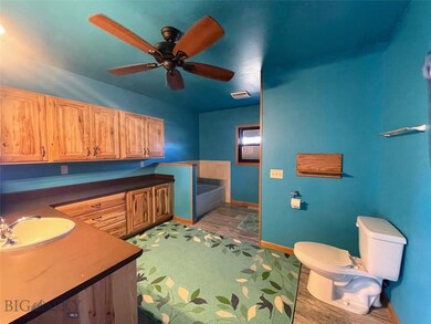 Ensuite primary bathroom with custom cabinets