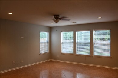 This home has an open floor plan with additional living room space that has an abundance of windows allowing a lot natural lighting.