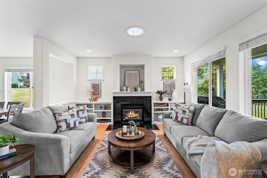 Lovely living area with built in bookshelves and gas fireplace