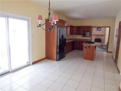 Kitchen. Pretty cherry cabinetry and granite count
