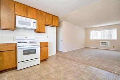 Family room on the right, with a/c wall unit.