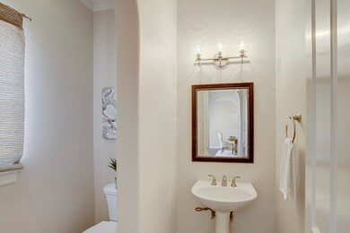 Powder bath downstairs is elegantly appointed.