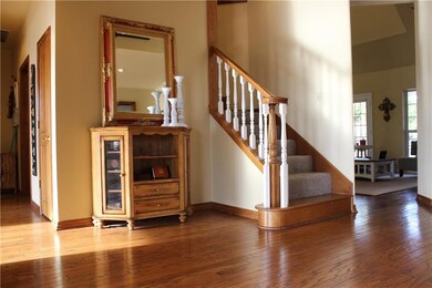 Beautiful entry with amazing real wood floors that are carried thru the family room, hall & kitchen
