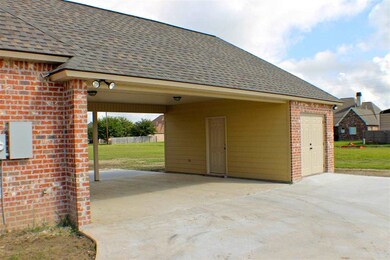 The exterior of the home features a 2 car carport 
