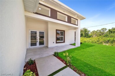 Back of house featuring a lawn