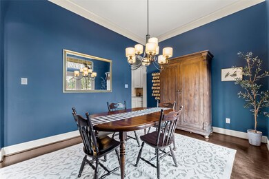 Spacious dining room with French doors that open up to the front porch.