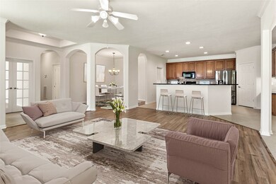 Newly installed luxury vinyl plank flooring flows throughout the spacious family and dining rooms.