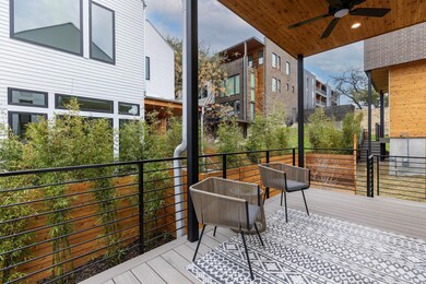 Wooden terrace featuring ceiling fan