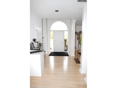 Gleaming wood floors greet you as you enter this m
