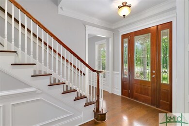 Foyer with staircase in front hallway.