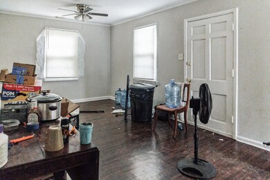 Office space with ceiling fan, wood-type flooring,