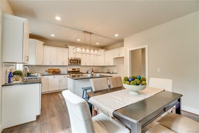 Kitchen is Loaded with White Cabinets & Island