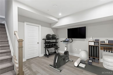 Virtual staged Exercise area featuring light wood-