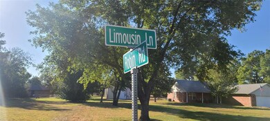 Community / neighborhood sign with a yard