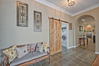 Utility Room is located off the garage entrance and Entry Way of the home.  Notice the cool barn door!