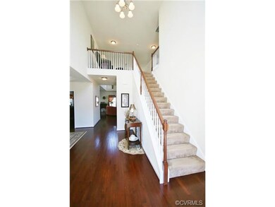 Open, Spacious Foyer boast beautiful cherry hardwo