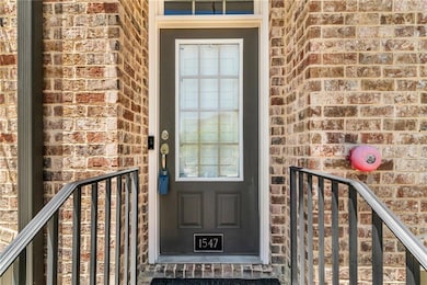 Entrance to property with brick siding