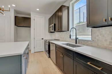 Kitchen with a sink, stainless steel appliances, 