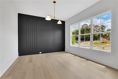 Unfurnished dining area featuring light wood finis