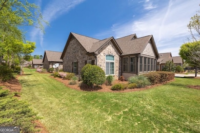 The landscaped berm in the back of the home makes for pretty views and added privacy