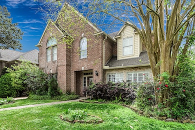 Brick and stone elevation gives this home a classi