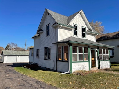View of front of property with an outdoor structur