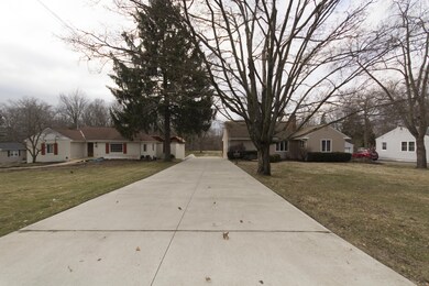 Front exterior - cement driveway