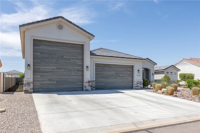 Ranch-style house featuring stone siding, stucco s
