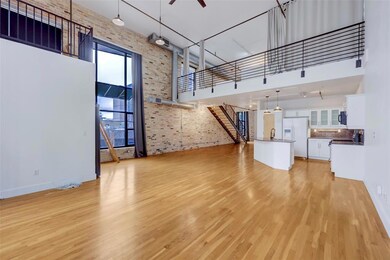 Unfurnished living room featuring a towering ceil