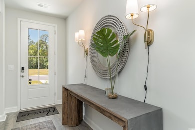Doorway to outside featuring wood finished floors,