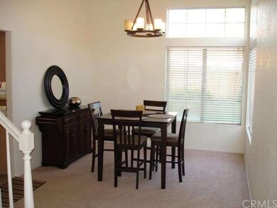 Bright and light formal dining room with entryway 