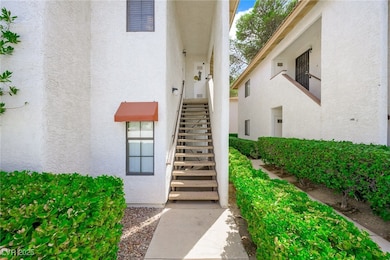 Entrance to property featuring stucco siding
