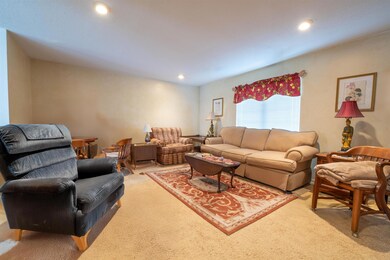 Living room featuring recessed lighting and light 
