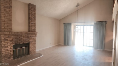 Unfurnished living room featuring wood finished fl