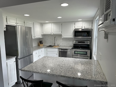 Kitchen with granite counters and stainless appliances