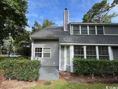 Rear view of property featuring a patio