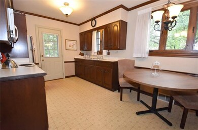 Large eat-in kitchen with lots of cabinets.  Light