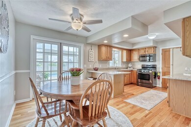 Kitchen/Dining with hardwood floors.