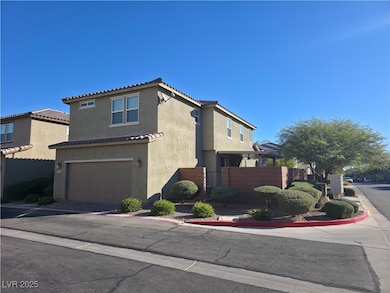 View of side of property featuring an attached garage, stucco siding, driveway, and a tiled roof