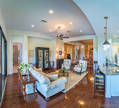 The great room, adjacent to the kitchen, is a grea