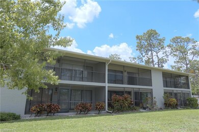 Rear view of house with a yard