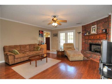 Large Family Room Offers Gleaming Wood Laminate Fl
