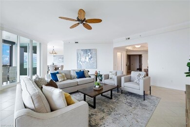 Tiled living room featuring ornamental molding and