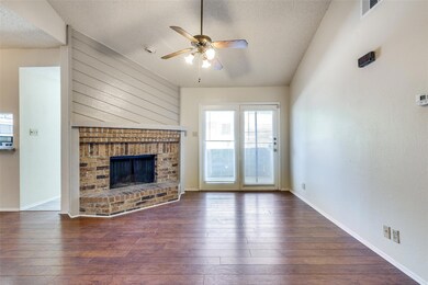 Unfurnished living room featuring dark hardwood / 