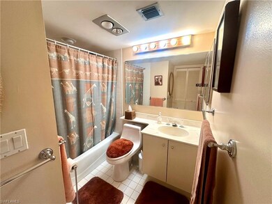 Bathroom with shower / bath combo, vanity, tile pa
