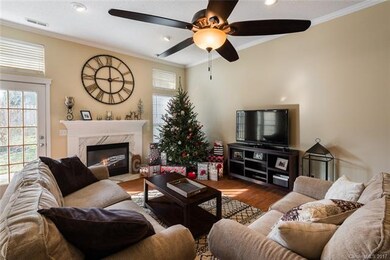 The family room boasts lots of light, high ceiings