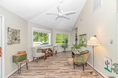 Living area with high vaulted ceiling, a ceiling f