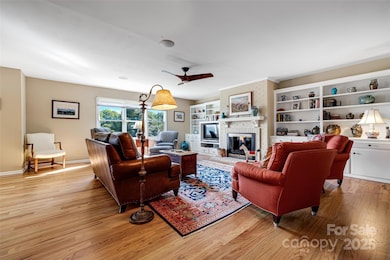 Gorgeous new wood floors, built ins, and the brick fireplace create a warm inviting atmosphere.