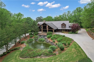 LOGHOUSE with Water Feature Entry & Double Circle Driveway